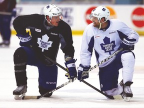 Leafs’ Dion Phaneuf and Phil Kessel have a chat during practice. (DAVE ABEL/Toronto Sun)