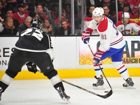 Montreal Canadiens center Lars Eller (81) moves the puck against the defense of Los Angeles Kings center Trevor Lewis (22) during the second period at Staples Center on March 5, 2015 in Los Angeles, CA, USA. (Gary A. Vasquez/SA TODAY Sports)