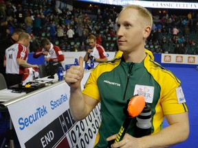 Team Northern Ontario skip Brad Jacobs gives a thiumbs-up to the fans in the crowd after his shot clinched the win overTeam Newfoundland/Labrador in the Page Playoff game at the Tim Horton's Brier 2015 at the Scotiabank Saddledome in Calgary, Alberta, on  Friday, March 6, 2015. Mike Drew/Calgary Sun/QMI AGENCY