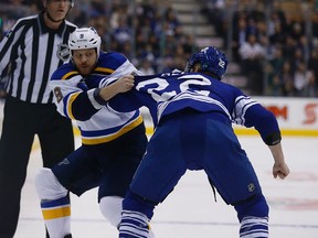 Sabres' Steve Ott fights Maple Leafs' Zach Sill during Saturday's game at the Air Canada Centre. (MICHAEL PEAKE/TORONTO SUN)