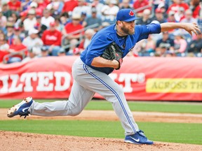 Mark Buehrle delivers a pitch against the Phillies on Saturday. He and Marco Estrada each turned in quick, efficient two-inning stints in the Jays 4-2 win. (STAN BEHAL, Toronto Sun)