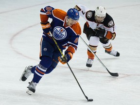The Edmonton Oilers' Oscar Klefbom (84) is chased by the Anaheim Ducks' Andrew Cogliano (7) during third period NHL action at Rexall Place, in Edmonton Alta., on Saturday Feb. 21, 2015. David Bloom/Edmonton Sun
