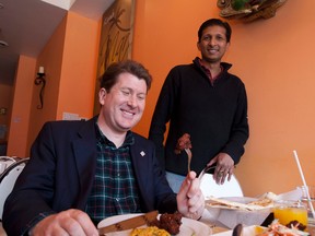 MP John Williamson meets with Naveen Polapady a Toronto restaurant owner. 
File photo by MICHAEL PEAKE/ TORONTO SUN/ QMI AGENCY