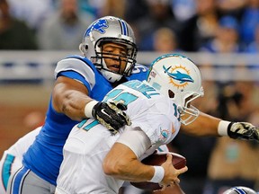 Ndamukong Suh of the Detroit Lions sacks Ryan Tannehill of the Miami Dolphins NFL play at Ford Field on November 9 , 2014 in Detroit. (Leon Halip/Getty Images/AFP)