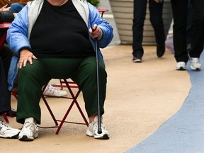 An overweight woman sits on a chair in Times Square in New York, in this May 8, 2012 file photo. 
REUTERS/Lucas Jackson/Files