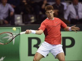 Swiss Henri Laaksonen returns the ball to Steve Darcis of Belgium during the Davis Cup first-round World Group tie on March 8, 2015 in Liege. (AFP PHOTO/BELGA/JOHN THYS)