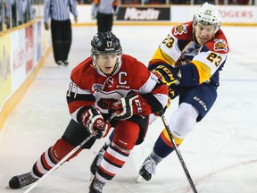 Ottawa 67's Travis Konecny battles with Erie Otters Kurtis McDermid during OHL hockey action at the Arena at TD Place. Feb. 1, 2015.
Errol McGihon/Ottawa Sun/QMI Agency