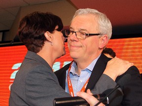 Manitoba NDP leadership candidate Greg Selinger (r) is hugged by fellow candidate Theresa Oswald after winning the leadership in the second ballot in Winnipeg, Man. Sunday March 08, 2015. (Brian Donogh/Winnipeg Sun/QMI Agency)
