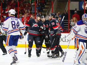 Carolina Hurricanes forward Alexander Semin (28) is congratulated by teammates Riley Nash (20)  John-Michael Liles (26) and Rasmus Rissanen (62) after his goal against the Edmonton Oilers at PNC Arena. (James Guillory/USA TODAY Sports)