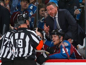 Colorado Avalanche coach Patrick Roy protests a call with referee Gord Dwyer during NHL play against the Los Angeles Kings at Pepsi Center February 18, 2015 in Denver. (Doug Pensinger/Getty Images/AFP)