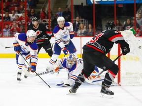 Mar 8, 2015; Raleigh, NC, USA; Carolina Hurricanes forward Jeff Skinner (53) scores a 2nd period goal past the Edmonton Oilers goalie Richard Bachman (32) and  defensemen Martin Marincin (85) at PNC Arena. Mandatory Credit: James Guillory-USA TODAY Sports