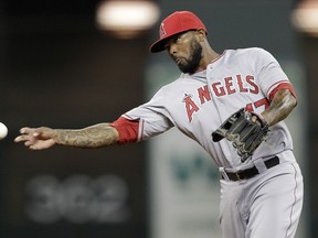 Howie Kendrick of the Los Angeles Angels throws to first during MLB action against the Houston Astros at Minute Maid Park September 3, 2014 in Houston. (Bob Levey/Getty Images/AFP)