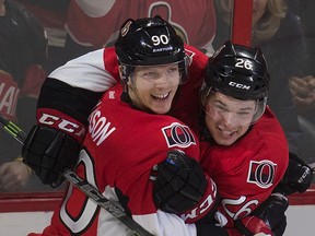Ottawa Senators Alex Chiasson celebrates his first period goal with teammate Curtis Lazar during first period play against the Calgary Flames at the Canadian Tire Centre in Ottawa Sunday March 8,  2015. (Tony Caldwell/Ottawa Sun/QMI Agency)