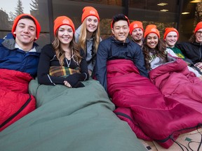 (Left to right) Members of 5 Days for the Homeless Oliver Philipp, Karley Frank, Tiona Tarapacki, Andy Kim, Oshadhi Perera, Jesse Young, Garrett Rokosh and Keaton Buchberger pose for a photo outside of the School of Business at the University of Alberta in Edmonton, Alta., on Sunday, March 8, 2015. Eight business school students are raising funds for the homeless by living outside for five days and eating donated food. The project is in its tenth year and was started at the U of A. Ian Kucerak/Edmonton Sun/ QMI Agency