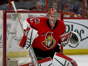 Ottawa Senators goalie Craig Anderson makes a save during second period against the Calgary Flames at the Canadian Tire Centre in Ottawa Sunday March 8,  2015.  Tony Caldwell/Ottawa Sun/QMI Agency