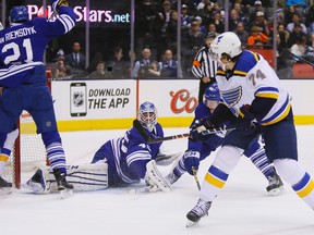 St. Louis Blues forward T.J. Oshie (74) scores on Toronto Maple Leafs goaltender Jonathan Bernier (45) as forward James van Riemsdyk (21) tries to keep the crease clear during the first period at the Air Canada Centre on March 7, 2015. (JOHN E. SOKOLOWSKI/USA TODAY Sports)