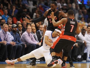 Oklahoma City Thunder guard Russell Westbrook loses his balance against a Raptors double-team in the second quarter at Chesapeake Energy Arena on Sunday. Overall, Westbrook put up 30 points, 17 assists and 11 rebounds in his team’s win. (MARK D. SMITH, USA Today Sports)