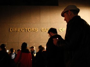 People march along Sunset Boulevard from the Directors Guild of America to the International Cinematographers Guild national offices in a candlelight walk and memorial for Sarah Jones, an assistant camerawoman who was killed by a train while shooting the Gregg Allman biopic film, Midnight Rider, on March 7, 2014 in Los Angeles, California. The remembrance of the 27-year-old camerawoman is organized by members of the International Cinematographers Guild and the production community who want to highlight the importance of safety over a production's schedule or budget. The accident which occurred February 20 on a train trestle over the Altamaha River in Georgia and injured seven other crew members.  David McNew/Getty Images/AFP