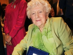 Dorothy Webster, 92, the sister of British flight engineer Sergeant John Thompson, wears his wedding ring and holds a box containing the remains of his Halifax bomber during a ceremony held at the Ministry of Defence in Tirana March 9, 2015. (REUTERS/Arben Celi)