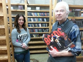 Jim MacCracken, right, owner of J-Mac Distribution, is closing down after 45 years in the Canadian music industry. Aimee Schroeder, left, manager of the CD and music DVD warehouse, said she's worried how this will effect local record stores. Photo taken on Tuesday, Feb. 17, 2015. (Keaton Robbins/Ottawa Sun)