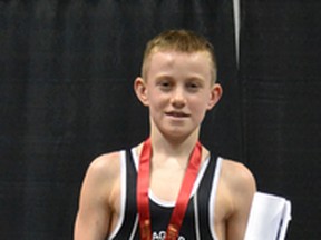 Greg Wilson, 15, from near Forest won the 2015 OFSAA wrestling gold medal in the boys 38-kg weight class. The Grade 10 North Lambton Secondary School student defeated Bluevale's Nick Forler in the final. (SUBMTTED PHOTO)
