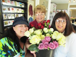 Volunteers with the Rotary Club of Sarnia, including from left, Christine Feige, Johnna Johansen and Adelle Richards, are getting ready for the club's 10th annual Rotary Roses fundraiser. The deadline to order roses is March 18. (Sarnia Observer)