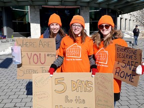 Queen's students Victoria Denney, from left, Lauren Stacey and Kelsey Ross will be camping outside for homelessness in front of Queen's University Stauffer Library.  (Ian MacAlpine/The Whig-Standard)