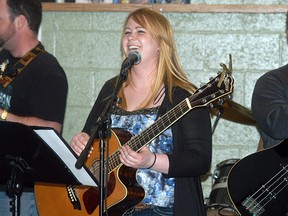 Lindsay Myers of the Boot Hill Boys band shares a laugh in between songs during a performance at the third annual Sombra Optimist chilli cookoff held at the Port Lambton Community Hall on Saturday.