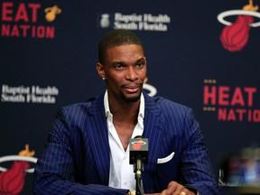 Miami Heat center Chris Bosh speaks to the media before a game between the Boston Celtics and Miami Heat at American Airlines Arena Mar. 9. (Robert Mayer/USA TODAY)