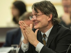 Councillor Gord Perks listens to the budget at the executive committee at City Hall in Toronto on Monday, March 2, 2015. (Craig Robertson/Toronto Sun)