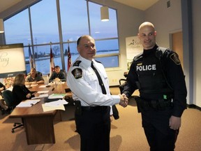 JEROME LESSARD/THE INTELLIGENCER
Thanks to the Const. Scott Preston, of Stirling-Rawdon police, concerned family members and friends of an 84-year-old man are relieved the police officer's prompt intervention on Feb. 14, 2015 guaranteed the safety of their love one. Preston, right, seen here with Chief Dario Cecchin, was commanded for his work during the police force's board meeting in Stirling Monday.