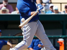 Dioner Navarro fouls off a pitch against the Tigers in Lakeland, Fla., on Monday. The Jays lost 6-4. (Stan Behal/Toronto Sun)