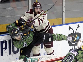 Peterborough Petes Cameron Lizotte body checks Kingston Fronteancs Roland McKeown during OHL action at the Rogers K-Rock Centre in Kingston last season. 
Ian MacAlpine/Kingston Whig-Standard/QMI Agency FILE PHOTO