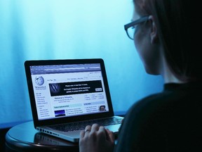 Wikipedia webpage in use on a laptop computer is seen in this photo illustration taken in Washington, Jan. 17, 2012. REUTERS/Gary Cameron