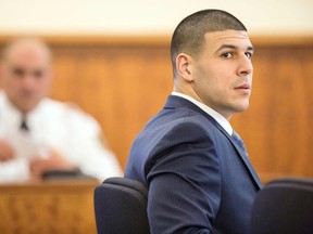 Former New England Patriots player Aaron Hernandez sits during his murder trial at the Bristol County Superior Court in Fall River, Mass., March 9, 2015. (REUTERS/Aram Boghosian/Pool)