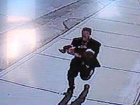A still image from surveillance video released by the Lincoln County Sheriffs Office shows a man who had allegedly grabbed a 22-month-old child from a stroller and ran, in Sprague, Washington, March 10, 2015. (REUTERS/Lincoln County Sheriffs Office/Handout via Reuters)