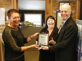 Jason Miller/The Intelligencer
From left: Coun. Jackie Denyes, Susan Walsh and Chamber CEO Bill Saunders share a photo-op with the plaque received from  Festivals and Events Ontario (FEO).