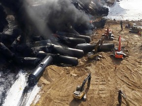 Smoke rises from fires caused by the derailment of a CN Railway train carrying crude oil near the northern Ontario community of Gogama, Ontario in this March 8, 2015 handout photo obtained by Reuters March 9.