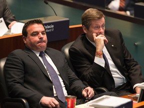 Mayor John Tory (R) and Councillor Giorgio Mammoliti during the reading of the budget on Tuesday, March 10, 2015. (Craig Robertson/Toronto Sun)