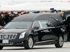 Pallbearers with the Canadian Special Operations Forces Command carry the casket of Sgt. Andrew Joseph Doiron to a hearse from a C-17 Globemaster during a repatriation ceremony at 8 Wing/CFB Trenton, Ont. Tuesday, March 10, 2015.  - JEROME LESSARD/THE INTELLIGENCER/QMI AGENCY