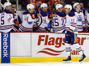 Rob Klinkhammer celebrates his first goal as an Oiler Monday against the Red Wings in Detroit. (USA TODAY SPORTS)