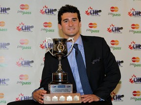 Ben Fanelli of the Kitchener Rangers, poses for a photo after winning the Home Hardware Humanitarian of the Year trophy, during the 2013 CHL Awards. (Al Charest/QMI Agency)