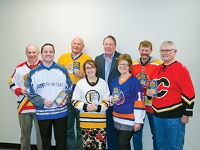 During the committee of the whole meeting on Wednesday, Mar. 4 town councillors, sporting their hockey jerseys, got MLA Pat Stier to pose for a photo supporting Pincher Creek’s bid in Kraft Hockeyville. John Stoesser photo/Pincher Creek Echo.