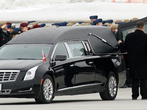 Pallbearers with the Canadian Special Operations Forces Command carry the casket of Sgt. Andrew Joseph Doiron to a hearse from a C-17 Globemaster during a repatriation ceremony at 8 Wing/CFB Trenton, Ont. Tuesday afternoon, March 10, 2015.  - JEROME LESSARD/THE INTELLIGENCER/QMI AGENCY