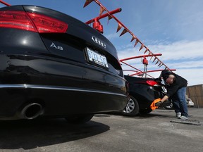 Kris Morrison cleans his car at Suds Car Wash on Merivale Rode in Ottawa Tuesday March 10,  2015. Warmer Ottawa temperatures are getting people out spring cleaning their cars Tuesday.   Tony Caldwell/Ottawa Sun/QMI Agency