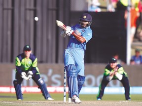 India’s Shikhar Dhawan hits a six against Ireland during their Cricket World Cup match. (REUTERS)