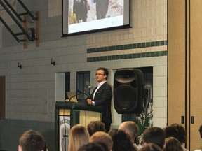 Dr. Greg Wells gives a presentation on wellness and its connection to improved academic and personal performance to the students and teachers at Holy Cross Catholic Secondary School. (Julia McKay/The  Whig-Standard)