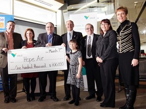 Vale's Kelly Strong presented Hope Air with a cheque for $100,000. Attending the presentation were (from left) Vale's Angie Robson, Nickel Belt MP Claude Gravelle, Hope Air executive director Doug Keller-Hobson, deputy Sudbury mayor Al Sizer, Hope Air client Tracy Menard, Nickel Belt MPP France Gelinas and Arianna Menard, also a Hope Air client.