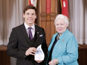 Seventeen-year-old Isaac Pinsonneault, of Pain Court, receives an Ontario Junior Citizen of the Year Award from Lieutenant-Governor Elizabeth Dowdeswell at Queen's Park in Toronto during a ceremony held March 9. He was one of 12 young people from across the province who were honoured.