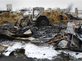 Gazley Road farmer in Wooler, Ont. John Vink had just parked in his tracker and plugged in its block heater when a fire broke out inside his barn around 5 p.m, Tuesday, March 10, 2015. The barn, seen here Wednesday, March 11, 2015, contained numerous bales of hay and two pigs perished in the blaze.  - Jerome Lessard/The Intelligencer
